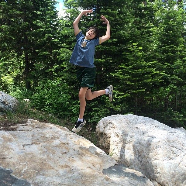 Aidan jumping for joy near Phelps Lake